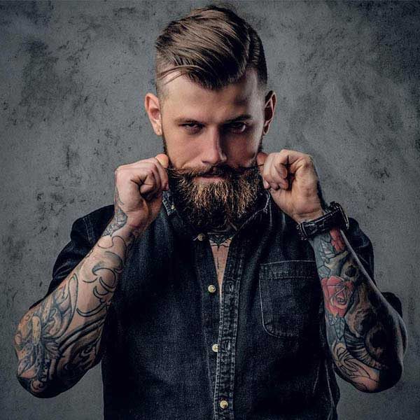 Barber shaping a client's beard